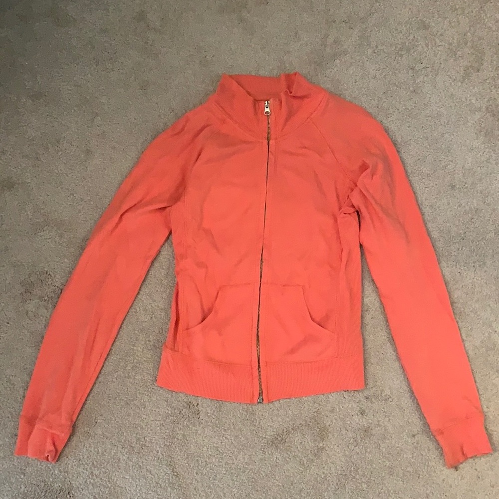 Light orange. Zip-up.